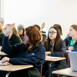 Sociology class with students asking questions